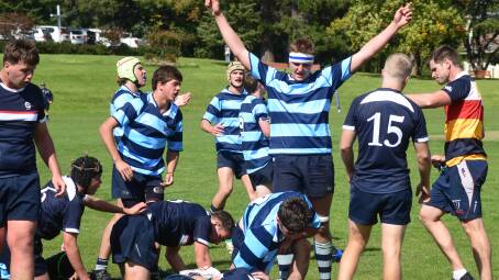 Ollie Walker (kneeling) gets up after scoring the winning try for Kinross. Picture by Carla Freedman