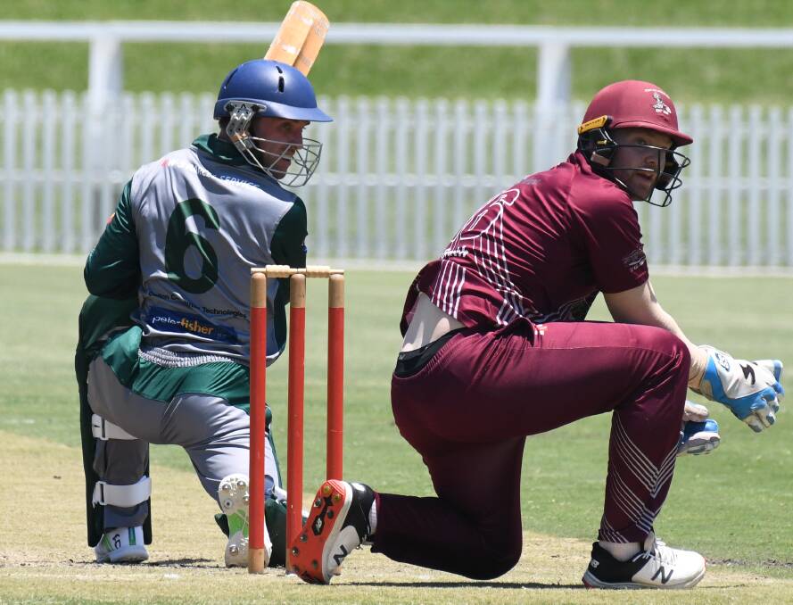 Orange City batter James Goldston-Morris and Cavaliers' wicketkeeper Matt Corben watch as the ball sails past them. Picturte by Jude Keogh