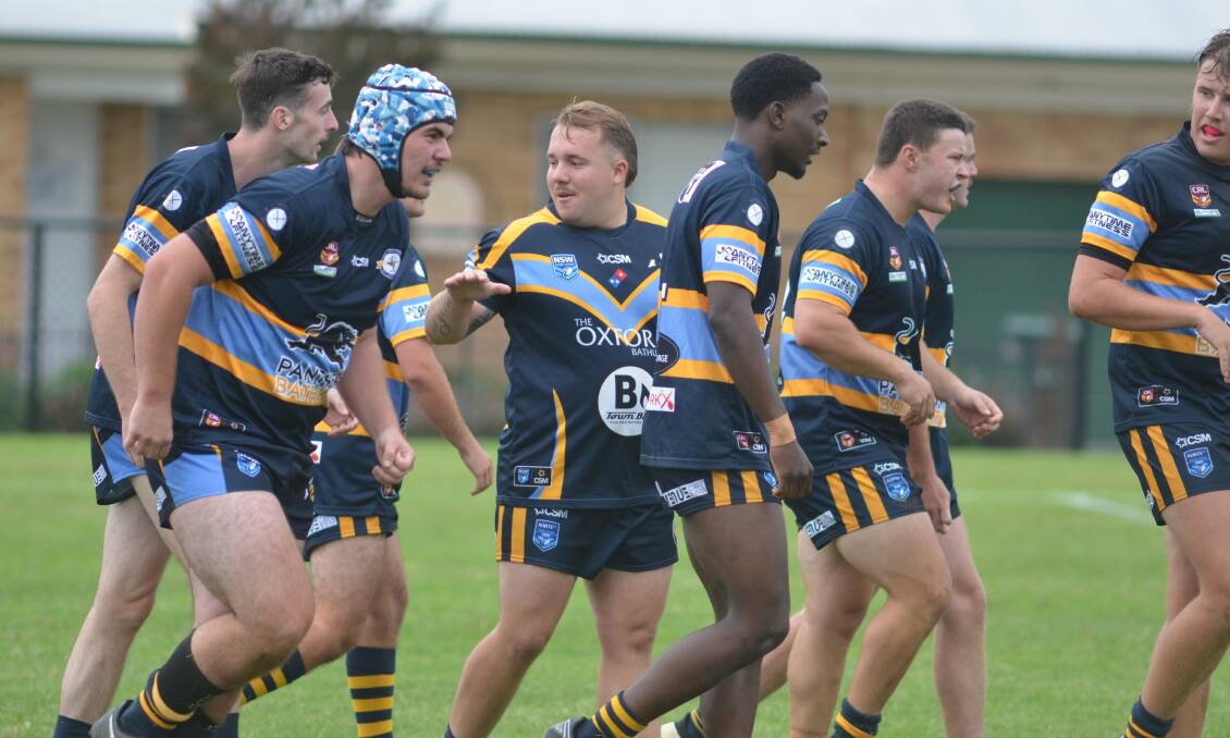 CSU Mungoes players celebrate a try. Picture by Dominic Unwin