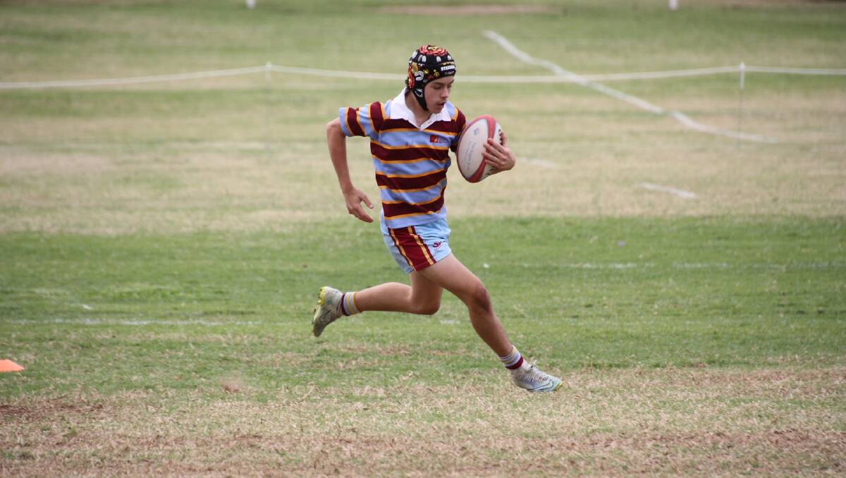 The Catherine McAuley rugby sevens side in action. Picture supplied