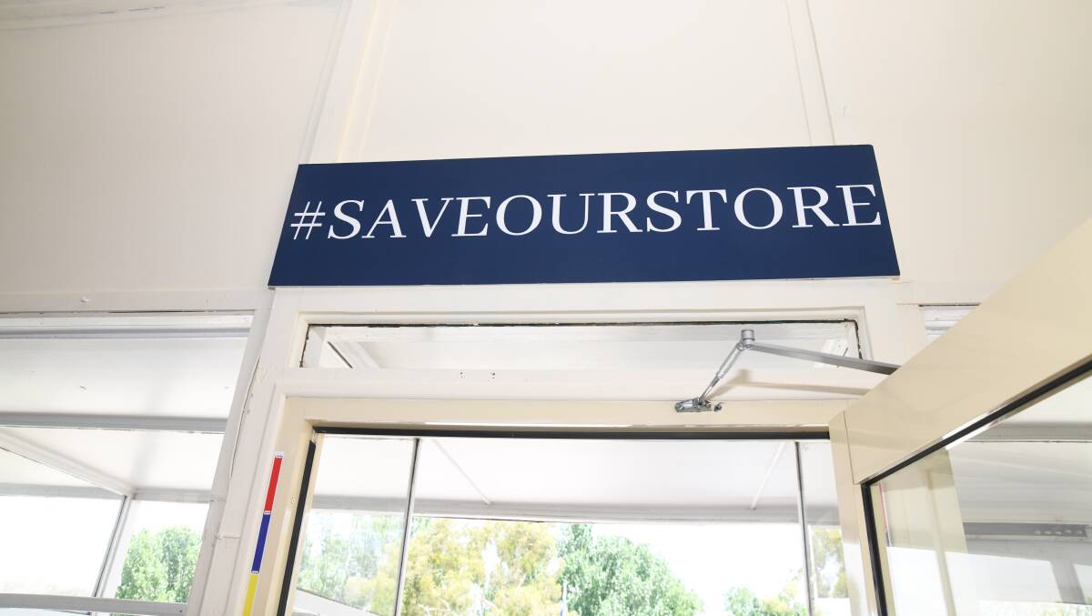 The #SAVEOURSTORE sign above The Cumnock General Store entryway. Picture by Jude Keogh. 
