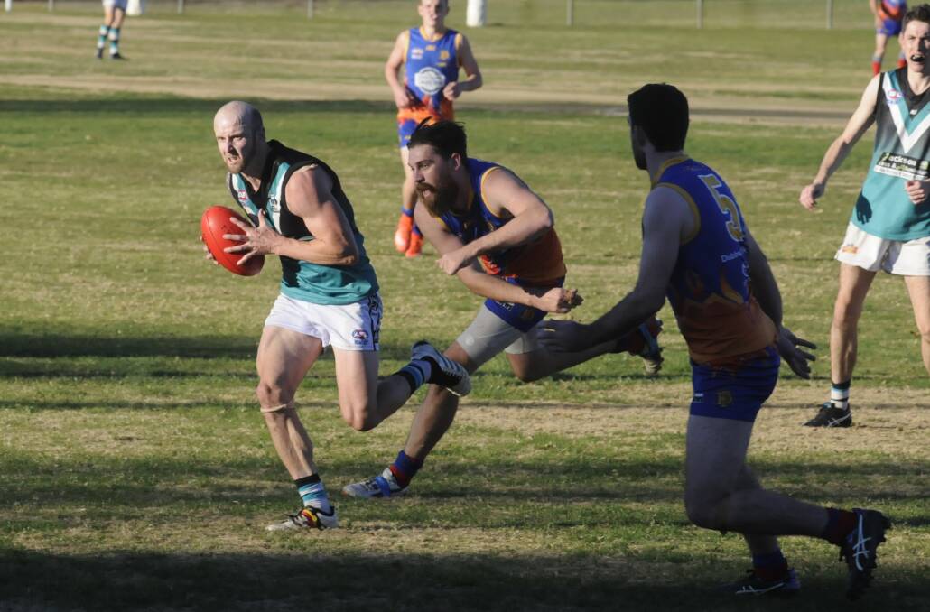 CLEARANCE: Bathurst Bushranger Outlaws' Nathan Belbin finds some space against Dubbo on Saturday. Photo: CHRIS SEABROOK