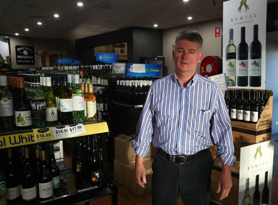 WARNING: Kelly's Hotel Bottle Shop owner Mark Kelly said an alcohol price rise caused by the bottle and can deposit scheme will hit hard at Christmas. Photo: PHIL BLATCH