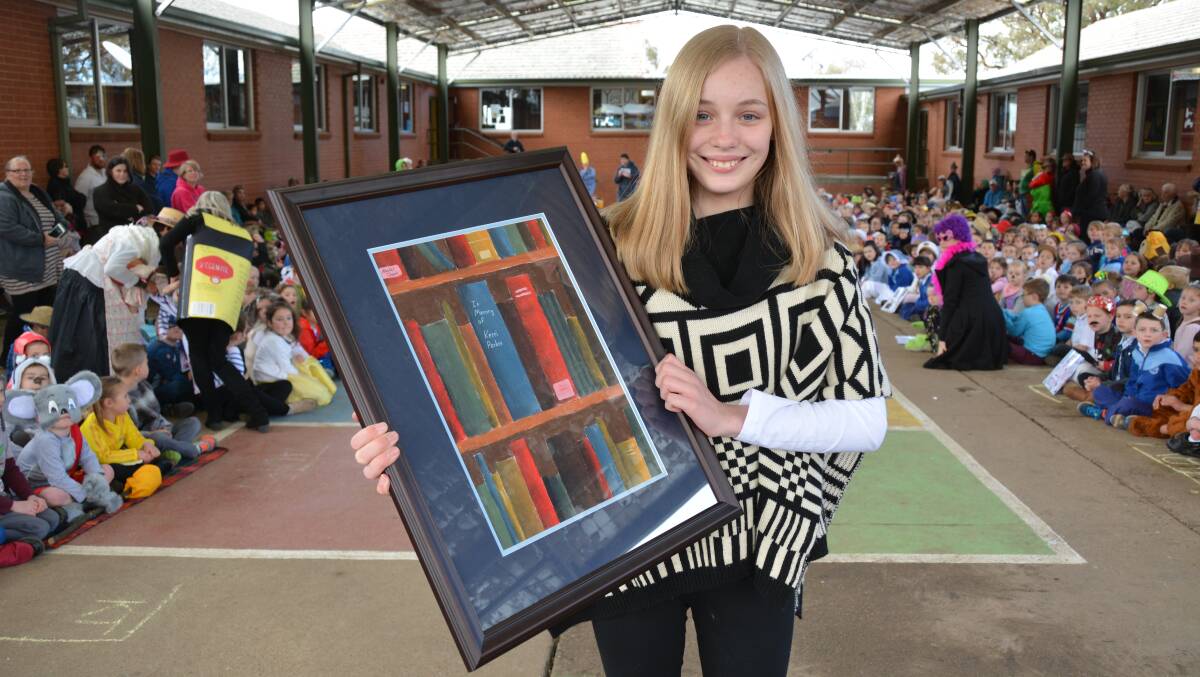 COLOURFUL TRIBUTE: Bletchington Public School year 6 student Rachel Chaim with her tribute to Kerri Parkes. Photo: ZENIO LAPKA