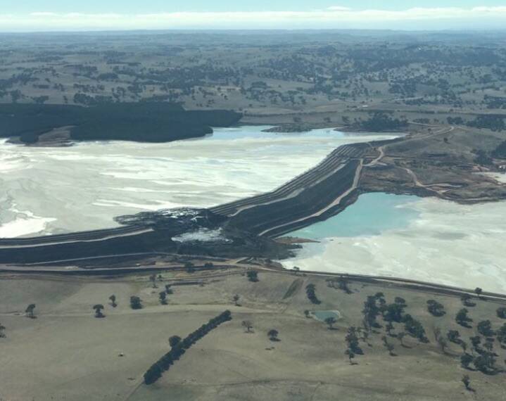 PARTIAL COLLAPSE: Damage to the wall between Newcrest Cadia Valley Operations mine's two tailings dams on Friday is shown in this aerial image taken over the weekend. Photo: RACHEL GOODSIR