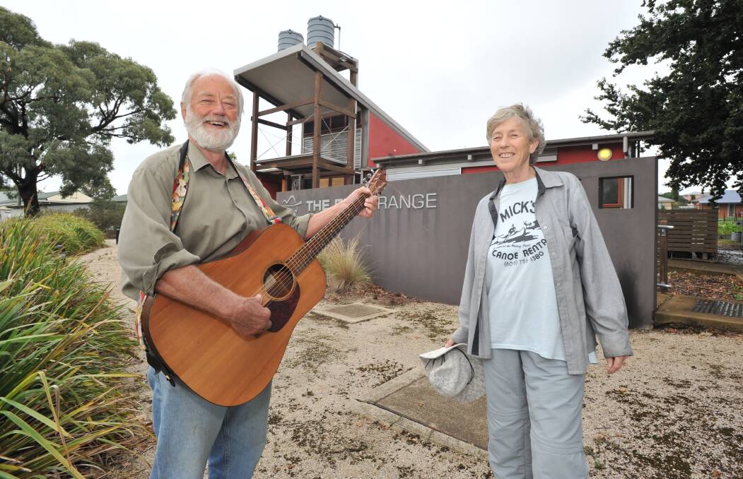 LET THERE BE (NO) LIGHT: Nick King and Cilla Kinross preparing for Saturday's Orange Dirt Music performance during Earth Hour. Photo: JUDE KEOGH