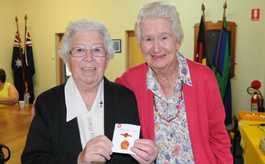 FLYING THE FLAG: Sister Mary Trainor with her life membership award and Jenny Gartrell from the Bloomfield and Riverside Hospital Auxiliary. Photo: STEVE GOSCH