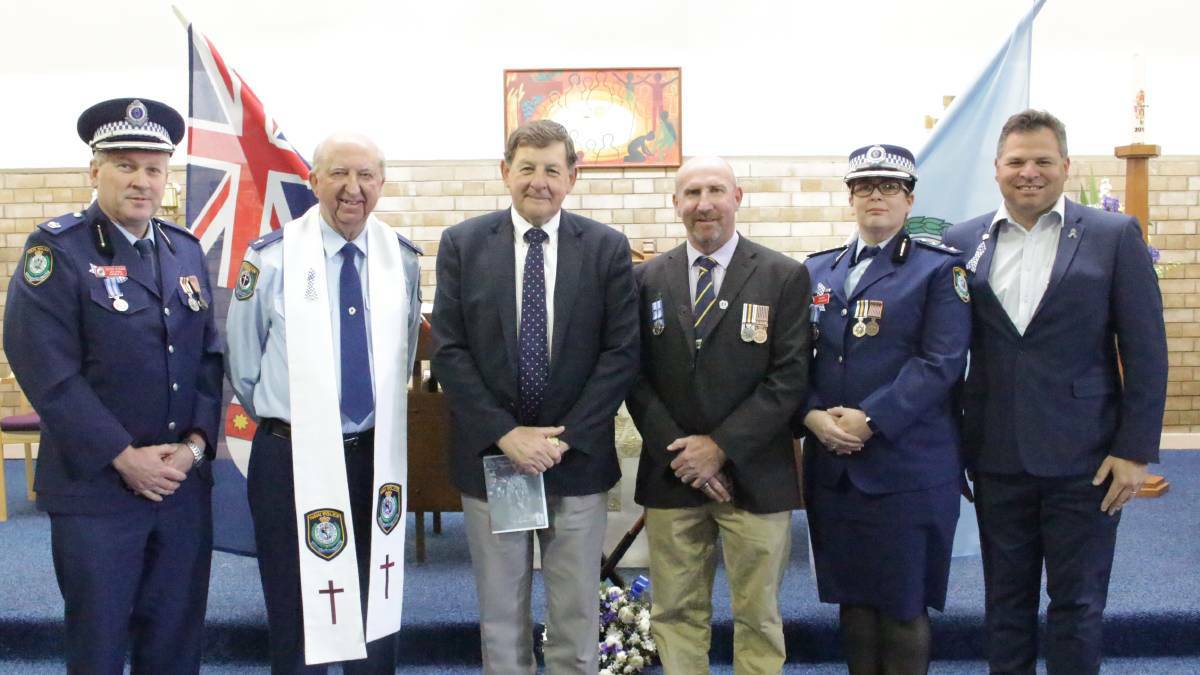 PAYING RESPECTS: Member for Orange Philip Donato (right) and others at Orange's National Police Remembrance Day ceremony.