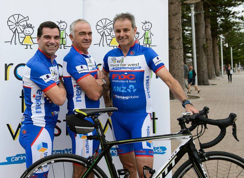 READY TO RIDE: Royal Far West’s Operations Director Kevin Bone with tennis great Wally Masur and Tour de France commentator Mike Tomalaris ahead of the ride.