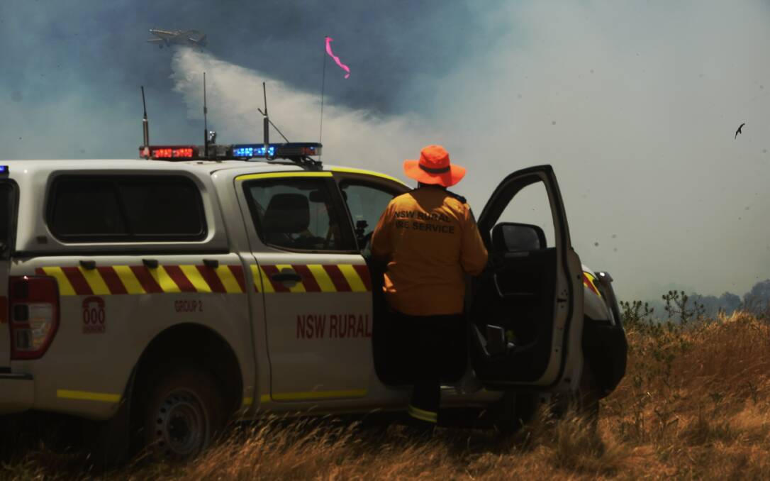 FROM THE AIR: RFS crews are fighting the blaze on the ground and in the air.