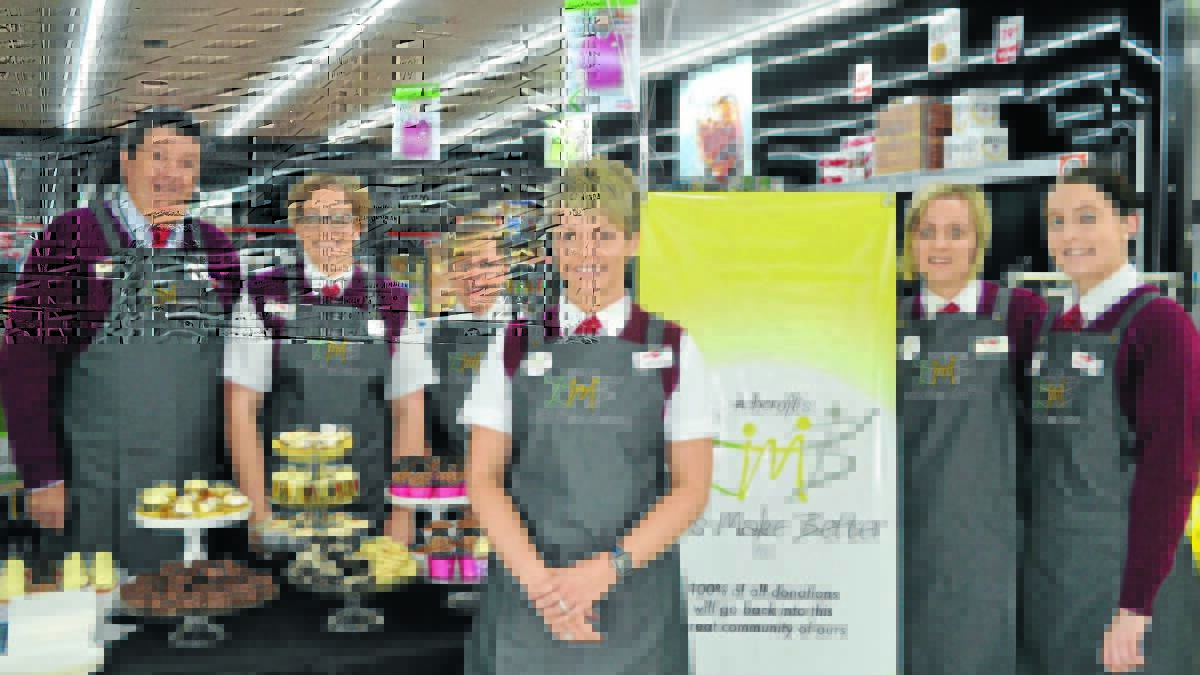 FULL COMMITMENT: IGA store owner Rochelle Ashcroft (centre) with staff members (from left) Robert Payne, Kristy Mansell, Karen Taylor, Jade Williams and Kim Jones launch Let’s Make Better, a charity where 100 per cent of donations will go to Orange community causes. Photo: TANYA MARSCHKE 0429tmiga1