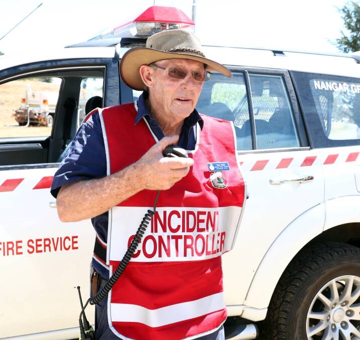 COPY THAT: Canobolas Zone NSW Rural Fire Service group captain Ray Nash hard at work near Nashdale. 0211amfire11