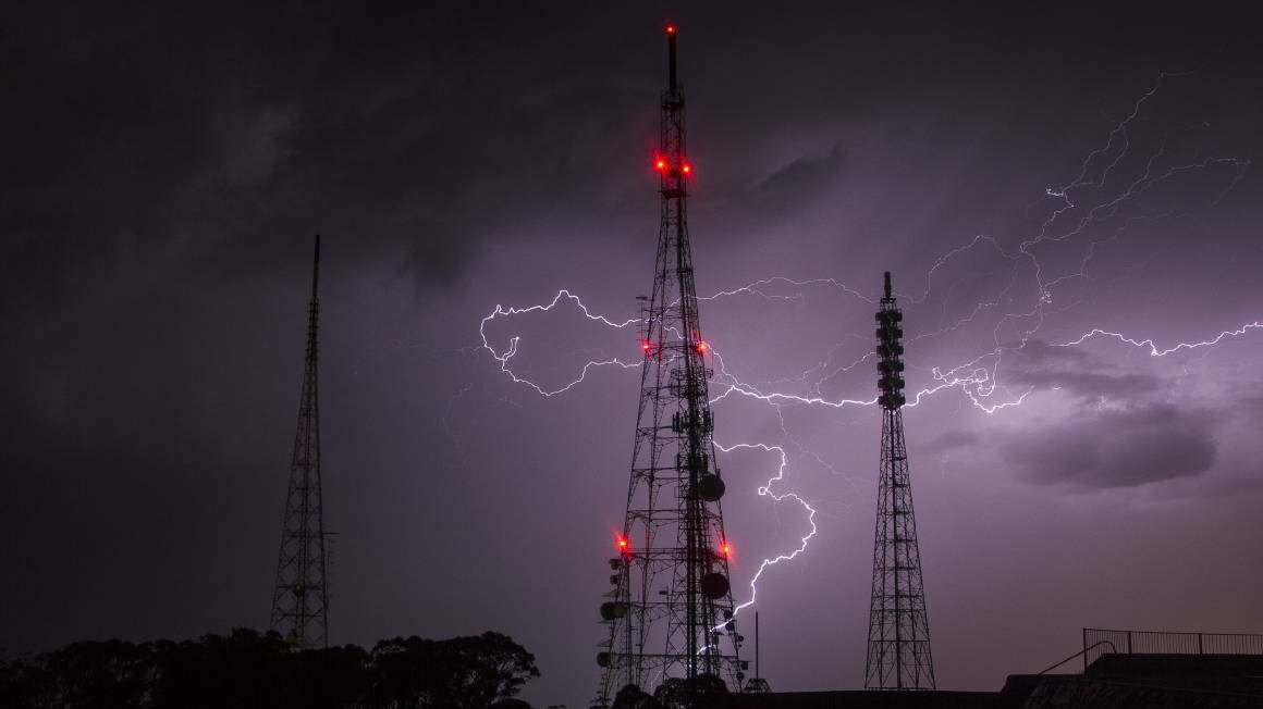 LIGHTNING RODS: The towers on Mount Canobolas make a dramatic backdrop as Orange is hit by another November storm. Photo: TROY BARRETT