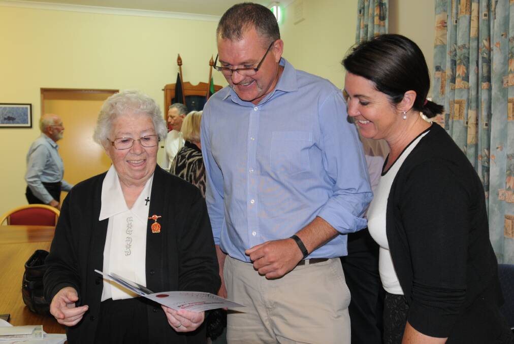 COME AND JOIN ME: Sister Mary Trainor with Jason Crisp and Helen McFarlane when she was made a life member of the United Hospital’s Auxiliaries of NSW in 2015.