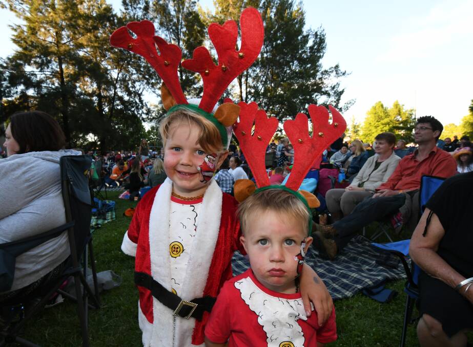 THEY'VE GOT THE SPIRIT: Hunter Puata and Knox Otto at Saturday evening's Carols by Candlelight. Photo: JUDE KEOGH