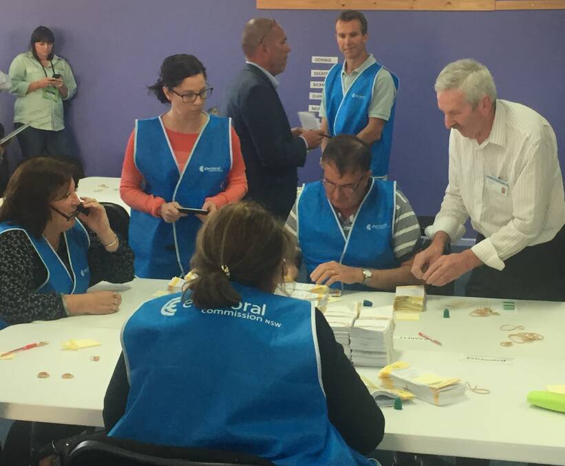 COUNTING ON YOU: NSW Electoral Commission staff were hard at on Thursday. Their numbers will be doubled when the Orange byelection recount commences at 8.30am on Monday. Photo: TONY RHEAD