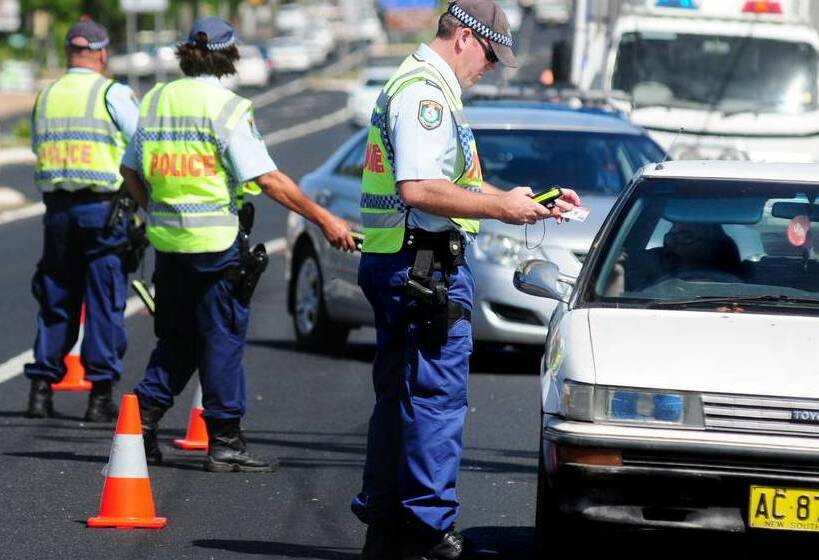 IN THE LINE OF FIRE: Police officers administering roadside random breath test, just like their unfortunate colleague was on Friday night. Photo: FILE PHOTO