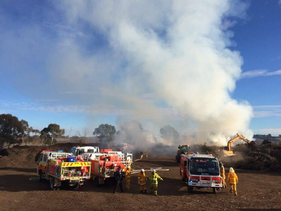 UNDER CONTROL: Fire crews at the scene of Monday morning's fire. Photo: CANOBOLAS ZONE RFS/FACEBOOK
