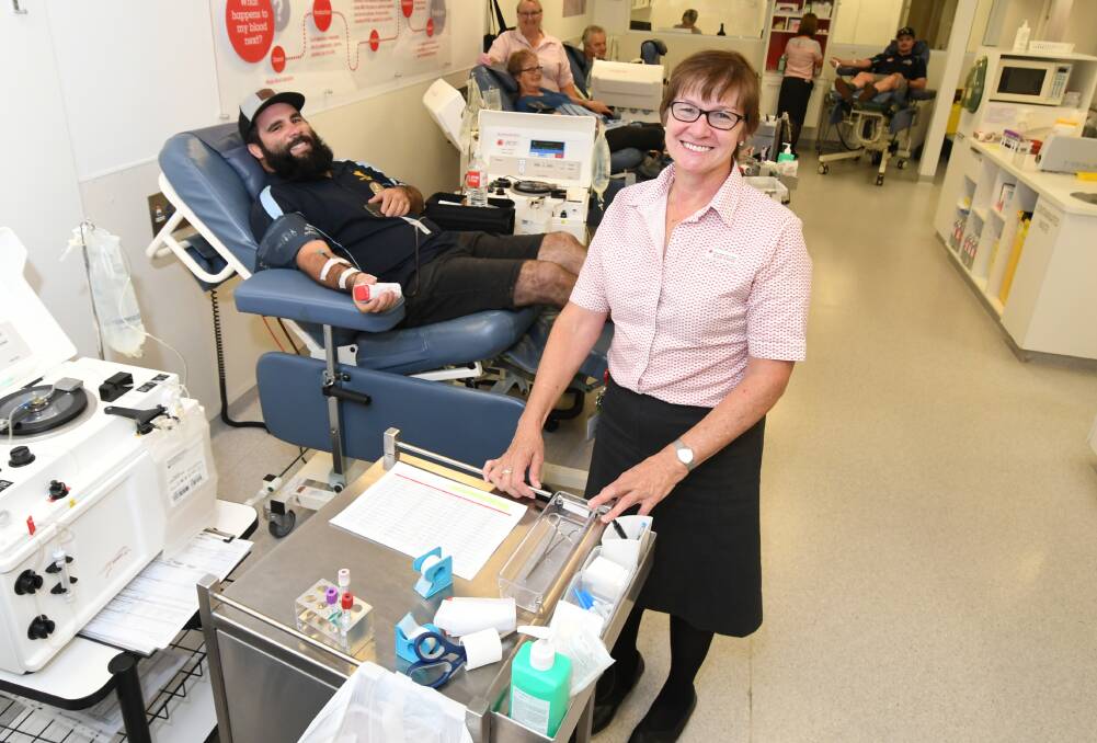 IN NEED: Tom Goolagong making a much-needed donation under the watch of Red Cross Blood Service Orange Donor Centre manager Gale Turnbull. Photo: JUDE KEOGH