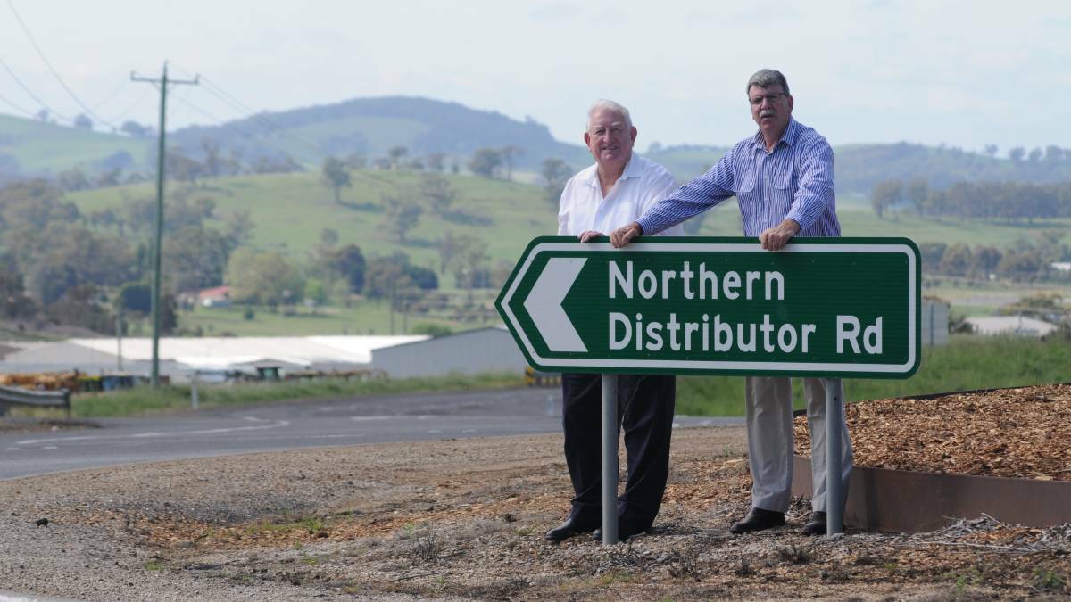FED UP: Orange City Council mayor John Davis and Cr Glenn Taylor at the contentious bypass. Photo: JUDE KEOGH