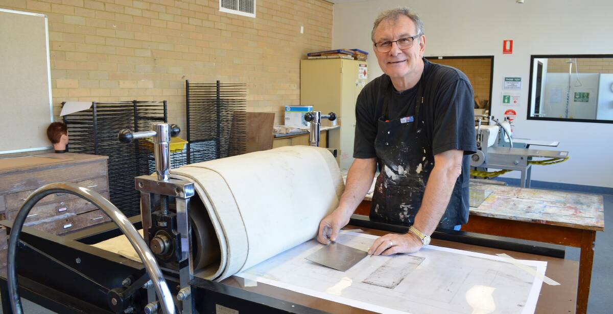 WORKING WITH THE BEST: Ron McBurnie conducts a printmaking workshop at TAFE Orange earlier this week. Photo: BRAD HAMMOND
