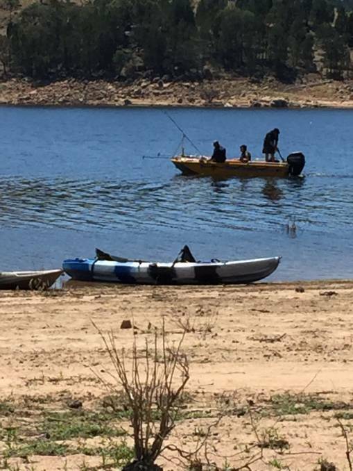 SEARCH: Police searching for the man at Wyangala Dam on the weekend.
