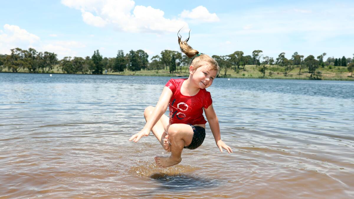 COOLING OFF: Miley Kennedy dips her feet. Photo: ANDREW MURRAY 1217amgos9