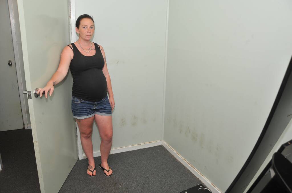 WORRIED: Kaylah Hayward with one of her mould-affected bedrooms when she was still pregnant with her sixth child. Photo: JUDE KEOGH