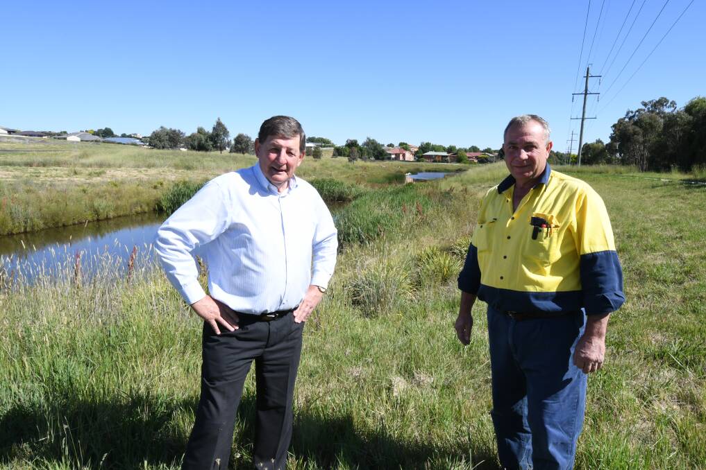 STORMWATER CALLED UPON: Mayor Reg Kidd and councillor Sam Romano at the Ploughmans Valley wetlands, which will supply the dual water system. Photo: JUDE KEOGH 1212jkwater1