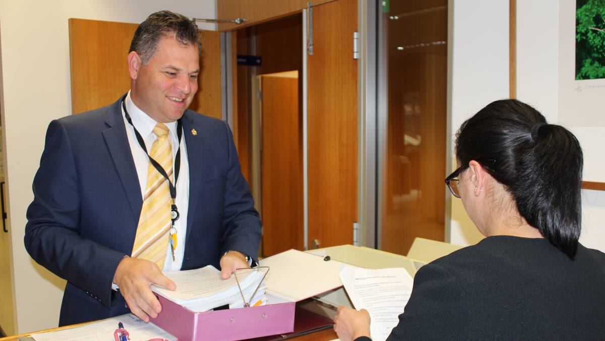 TABLED AT LAST: Member for Orange Phil Donato submits the petition calling for a palliative care unit in Orange in State Parliament on Tuesday.