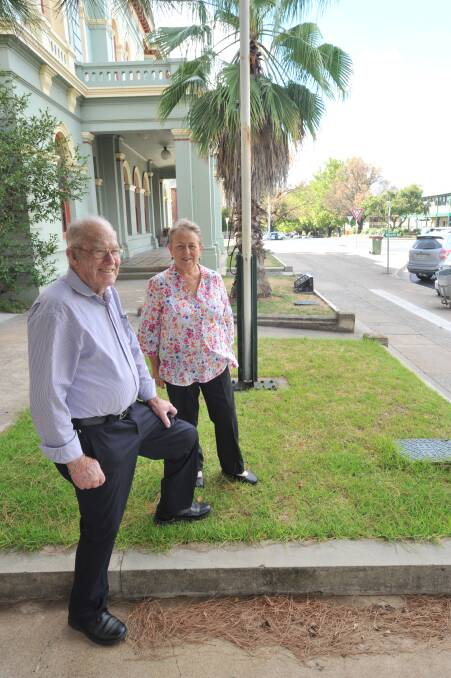 DISAPPOINTED: Orange RSL sub-branch members Les McGaw and Roslyn Davidson at the flagpole. Photo: JUDE KEOGH 0308jkstatue2