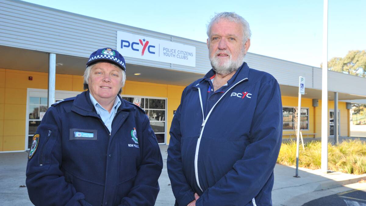 BRIDGING THE GAP: Senior Constable Helen Baker and Orange PCYC's Dave Cleal. Photo: JUDE KEOGH 0622jkpcyc1