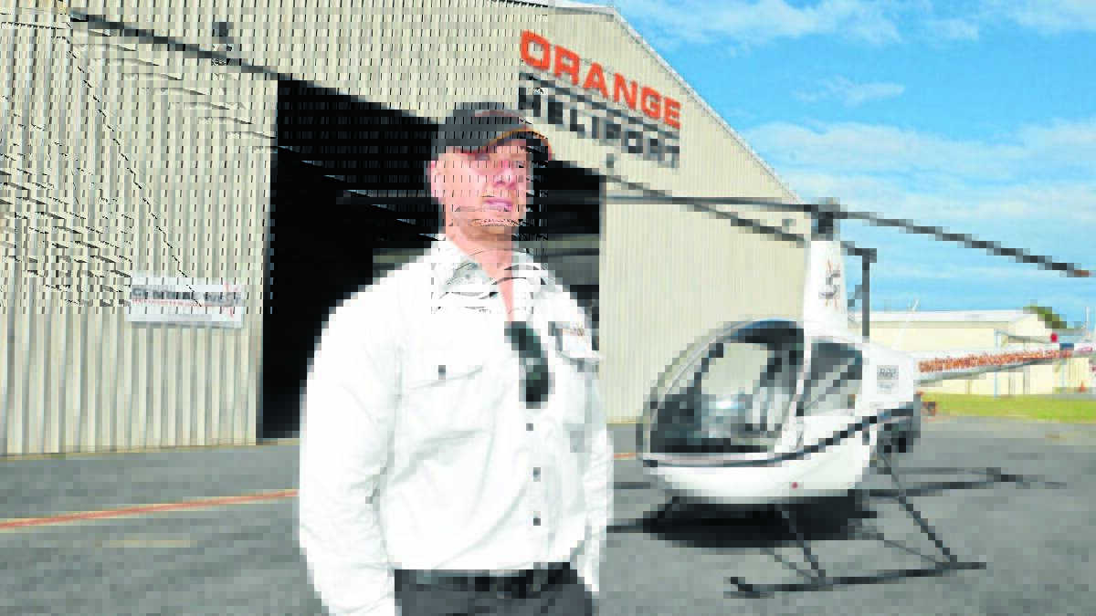 Central West Helicopter School’s Joel Stewart is opposed to landing fees for light aircraft at Orange Airport. Photo: JUDE KEOGH.0709airport1