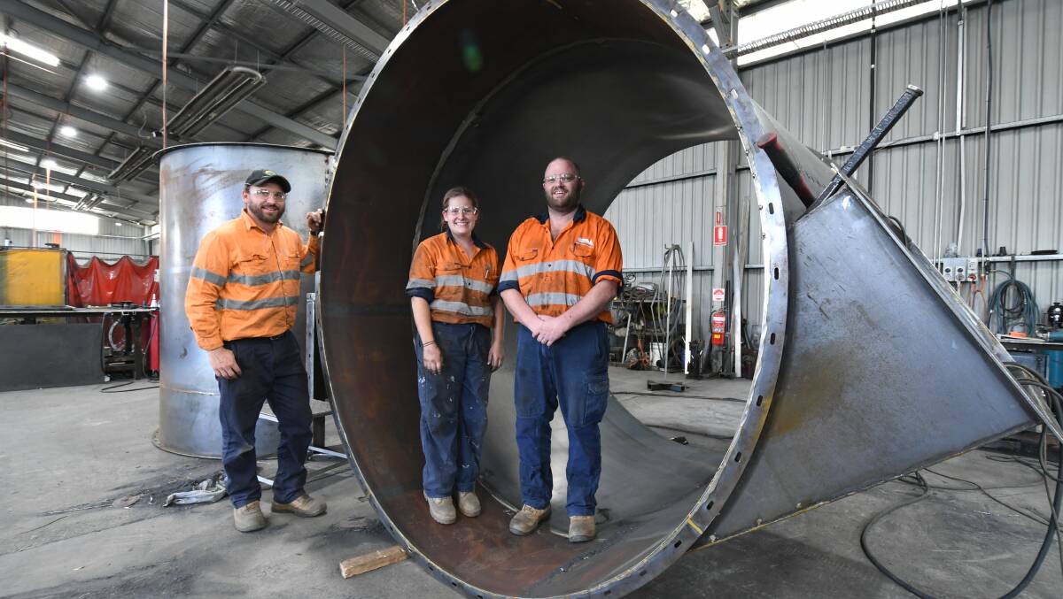 CYCLONE SEASON: Orange Precision Metalwork's Simon Kukla, McKenha Elliot and  Clint Matthews inside the cotton cyclone. Photo: JUDE KEOGH 0223jkopm1