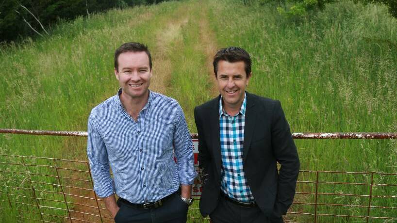 TWO WEEKS TO GO: One Agency's Josh Fitzgerald and Ash Brown at the site of Shiralee's first subdivision. Photo: PHIL BLATCH 1123pbash1