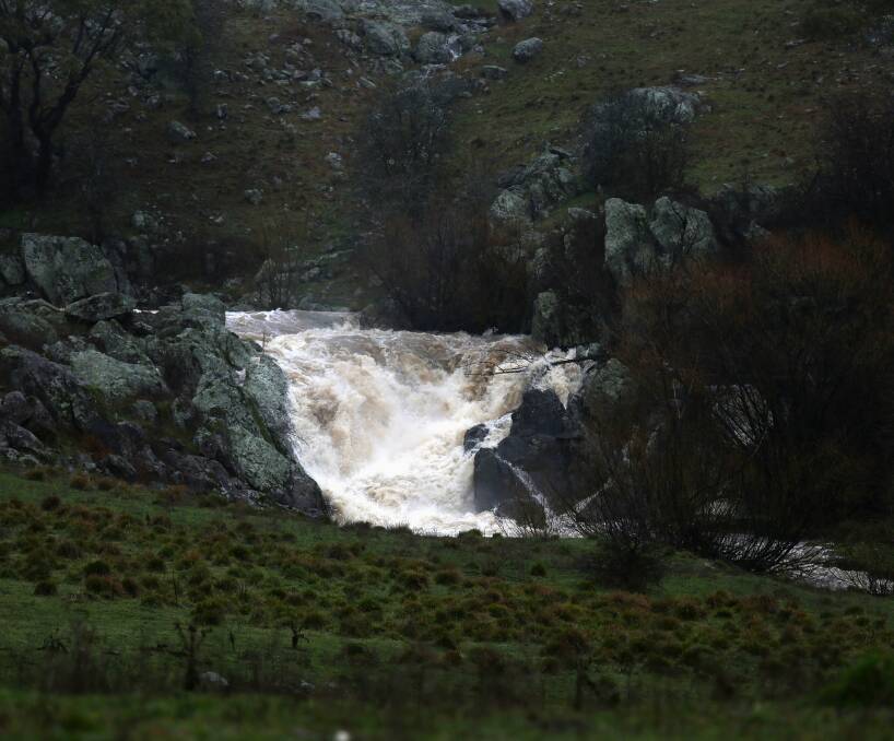 DELUGE CONTINUES: This creek off Ophir Road has been flowing freely in the aftermath of recent rain. Development downstream of Suma Park Dam is set to be limited. Photo: PHIL BLATCH 0712pbwet11
