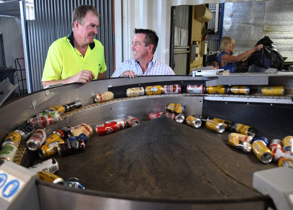 SORT IT OUT: Bathurst Recycling manager Craig Clark and Member for Bathurst Paul Toole at one of the automatic sorting machines at the business.