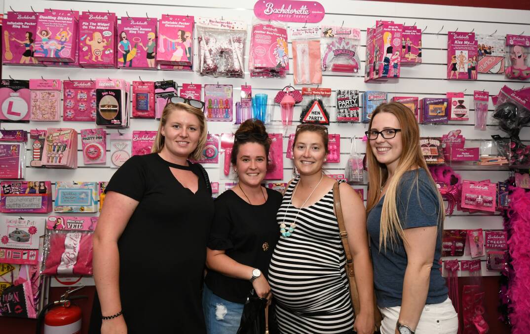 HAPPY HENS PARTY: Hayley Barker, Chloe Thompson, Gemma Wright and Bec McLean were shopping for party supplies at the Flirt Adult Store. Photo: JUDE KEOGH 0111jkflirt1