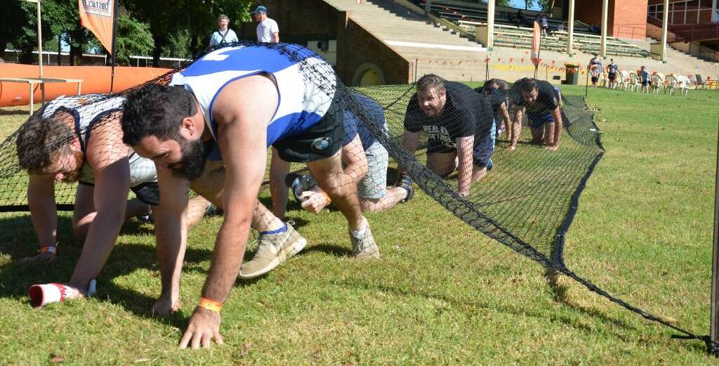 TORTURE TEST: Athletes completed many challenges in the Outback Obstacles challenge at Towac Park on January 21 but the longest wait has been for prepaid merchandise as part of the entry fee.
