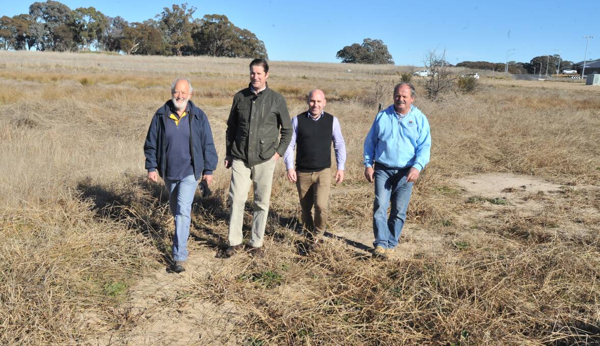 WETLAND WALK: ECCO president Nick King, chair of the Central West environment and waterway alliance David Waddell, Local Land Service project support officer Mick Callan and vice-president of the Waratah Sports Club Bart Westgeest inspect the site of the Waratah Wetland. Photo: JUDE KEOGH 0727jkwetlands4