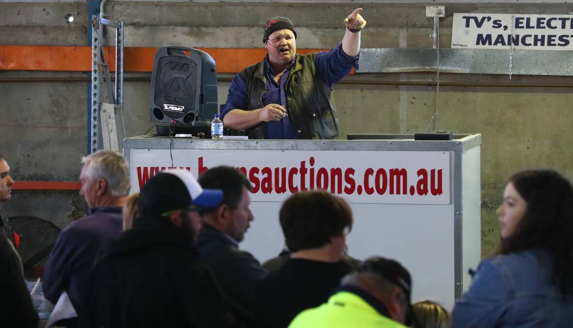 WHAT AM I BID: Auctioneer Scott Burns keeps the action rolling at the Orange Live Auction on Sunday morning. Photo: PHIL BLATCH 0813pbauction4