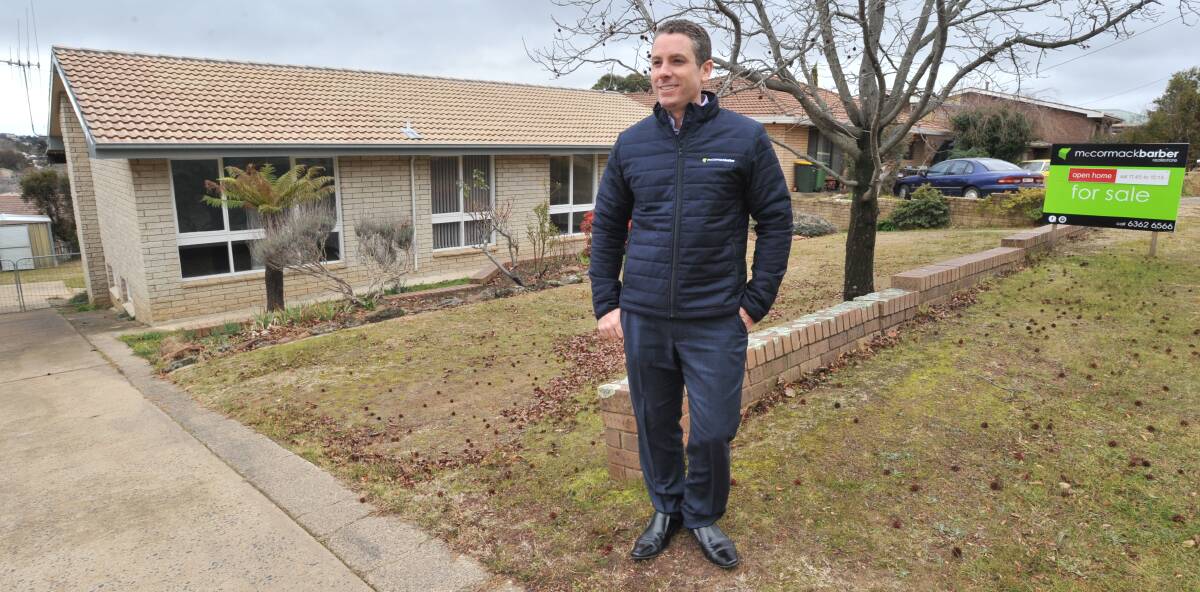 MEDIAN PRICE: McCormack Barber director Peter McCormack outside a house in Wolsley Street for sale for $369,000 - about the current Orange average price. Photo: JUDE KEOGH 0719jkhouses1