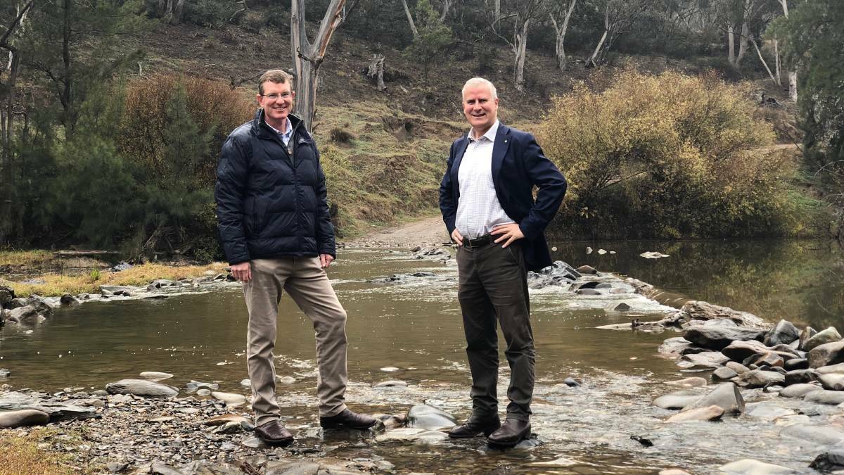 RIVER: Member for Calare Andrew Gee and Deputy Prime Minister Michael McCormack at the site where the Macquarie River crosses Dixons Long Point Road. Photo: Supplied