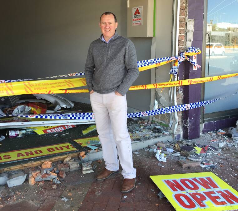 RUBBLE: Owner Craig Jaques outside the severely damaged shops. Photo: DAVID FITZSIMONS