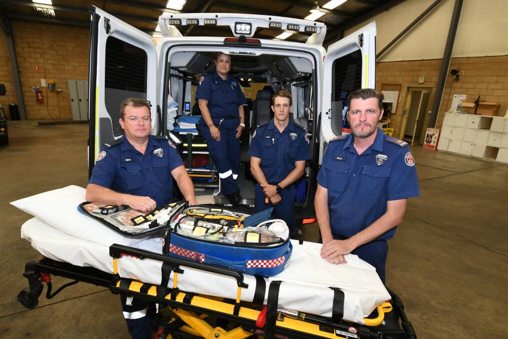 CHRISTMAS MESSAGE: NSW Ambulance paramedics Matt Tucker, Leah Butcher, Jock Cartwright and Inspector Rhys Dive. Photo: JUDE KEOGH 1312jkambos1