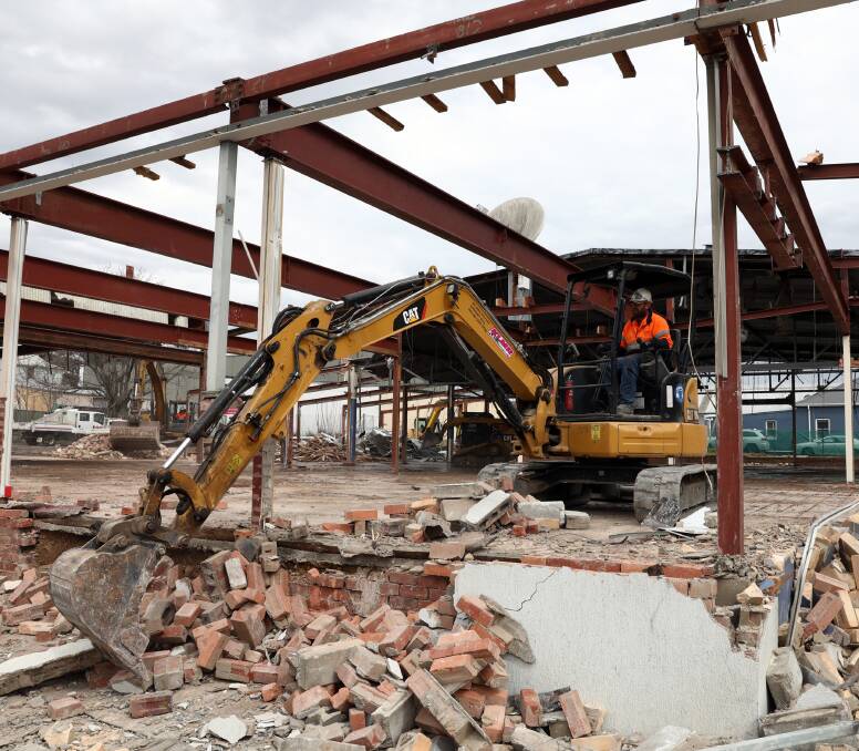 GONE: A digger wrecks the old CWD building. Photos: ANDREW MURRAY