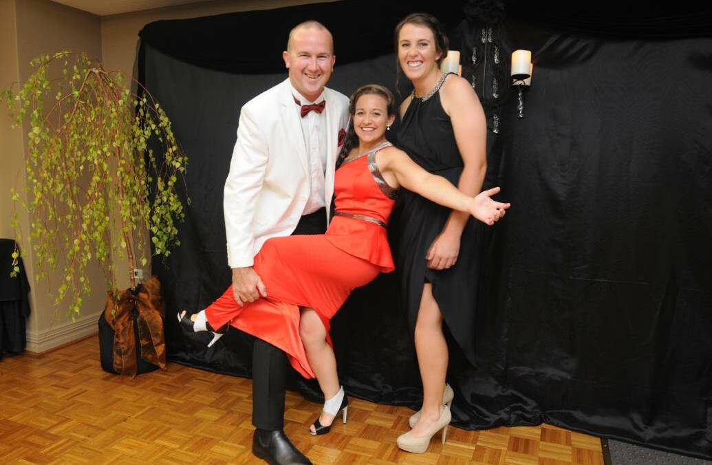 DANCING DAYS: Alicia McDonell (centre) with David Finlay and Monique Faul at a business awards dinner in Orange. 