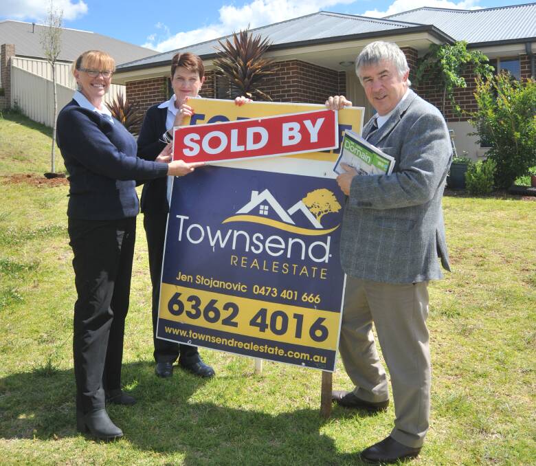 ANOTHER SALE: Townsend Real Estate's Jen Stojanovic and Kathie and Stephen Townsend celebrate another property success with Domain. Photo: JUDE KEOGH 