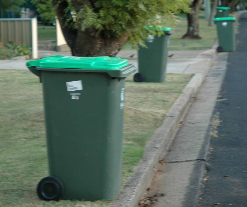 WAITING GAME: Green bins wait to be emptied on Breen Street this week. Photo: Supplied