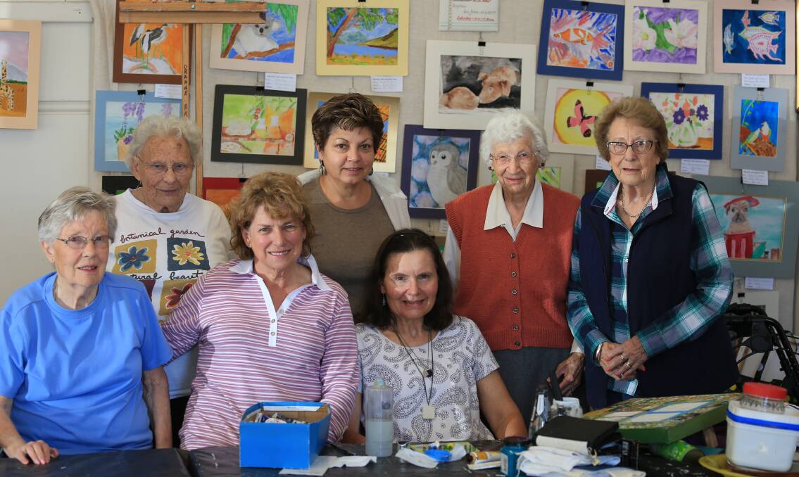 SHOW TIME: Artists Rowan Green, Lorna Moore, Wanda Driscoll, Maria Henriquez, Margie Moon, Daphne Myer and Joan Ross are ready for their annual Christmas art show. Photo: PHIL BLATCH